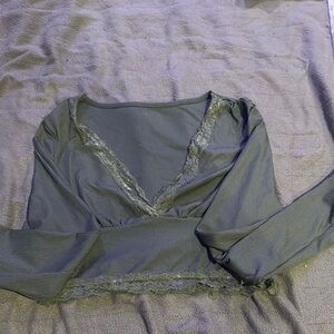 Green, cropped, lace lined shirt.